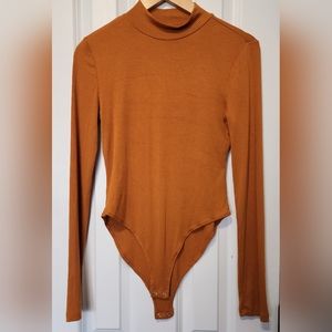 Long sleeve tan women's bodysuit
